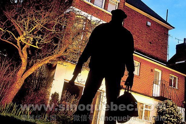 Burglar-studying-exterior-of-house-rear-view-silhouette.jpg